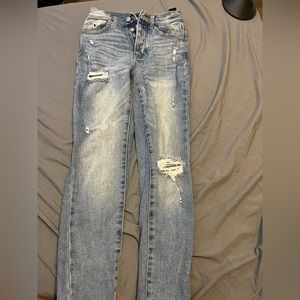 Distressed denim jeans